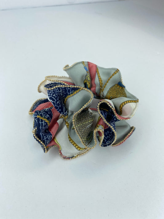 White scrunchie with blue and pink pattern