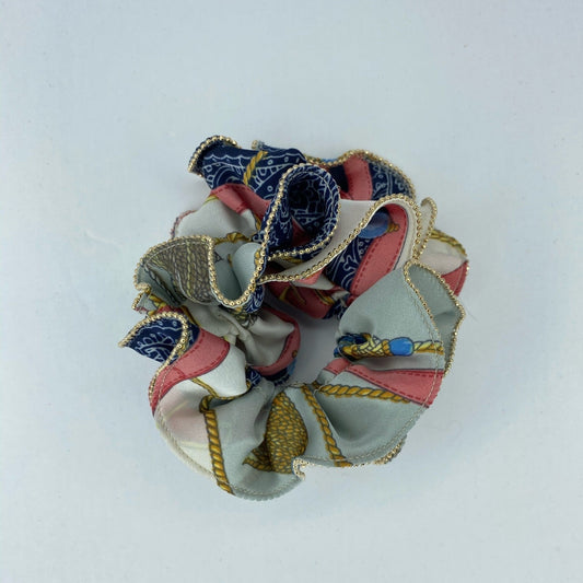 White scrunchie with blue and pink pattern